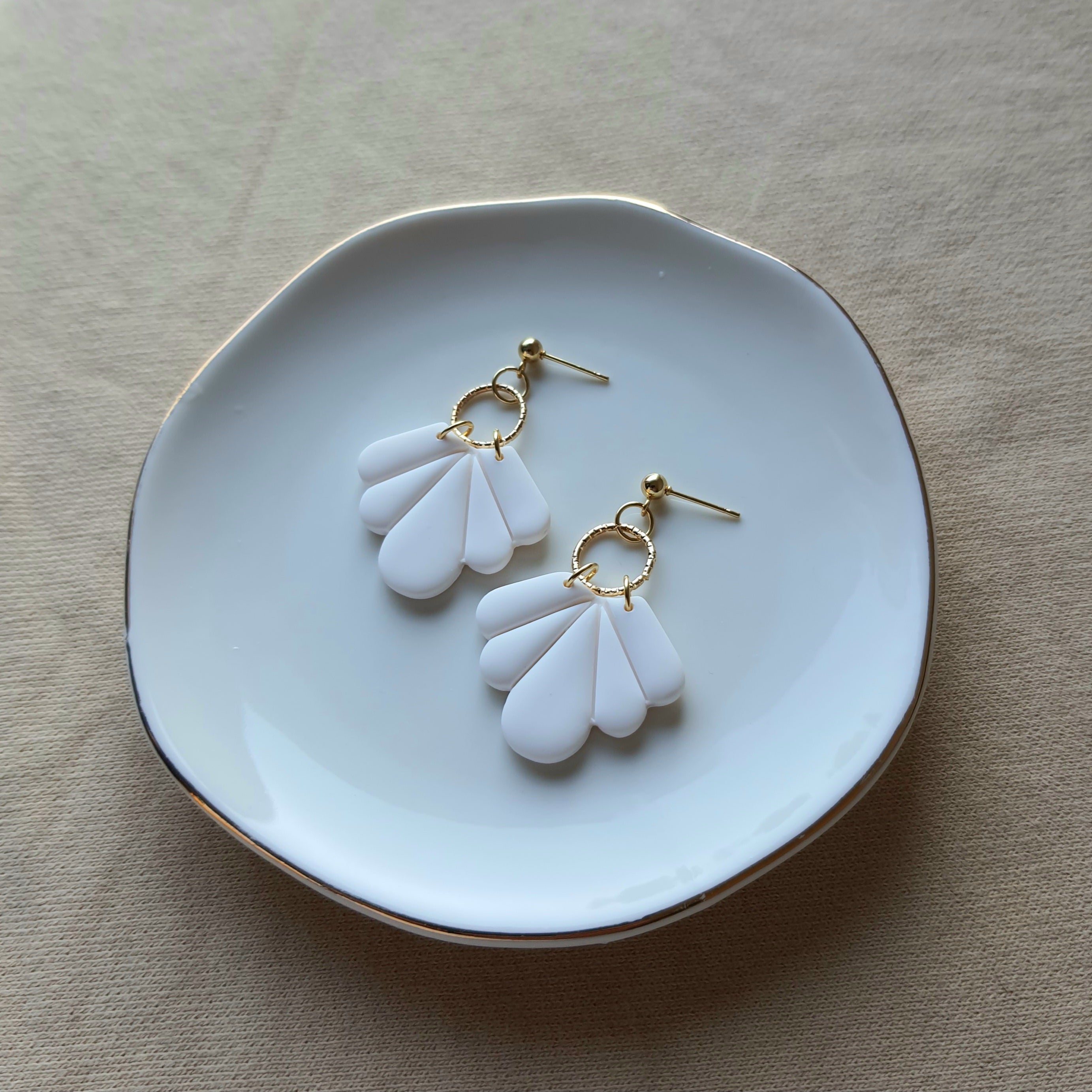 White fan dangle earrings