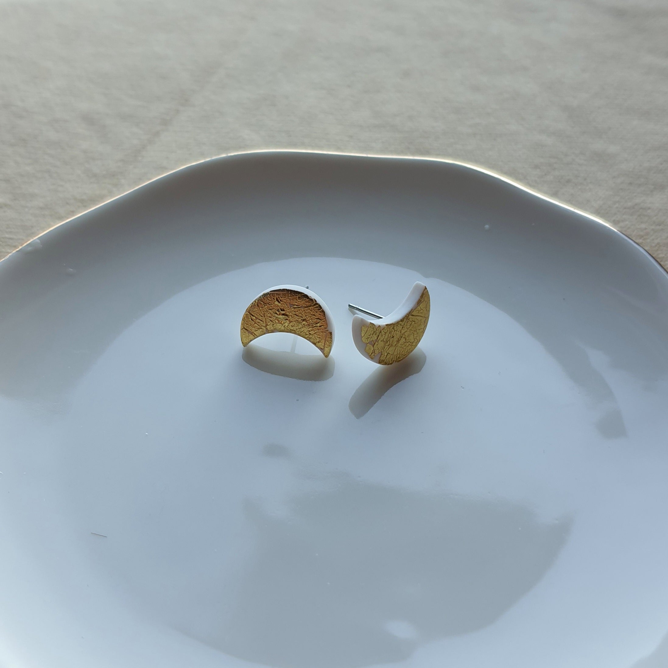 White moon with golden flakes stud earrings