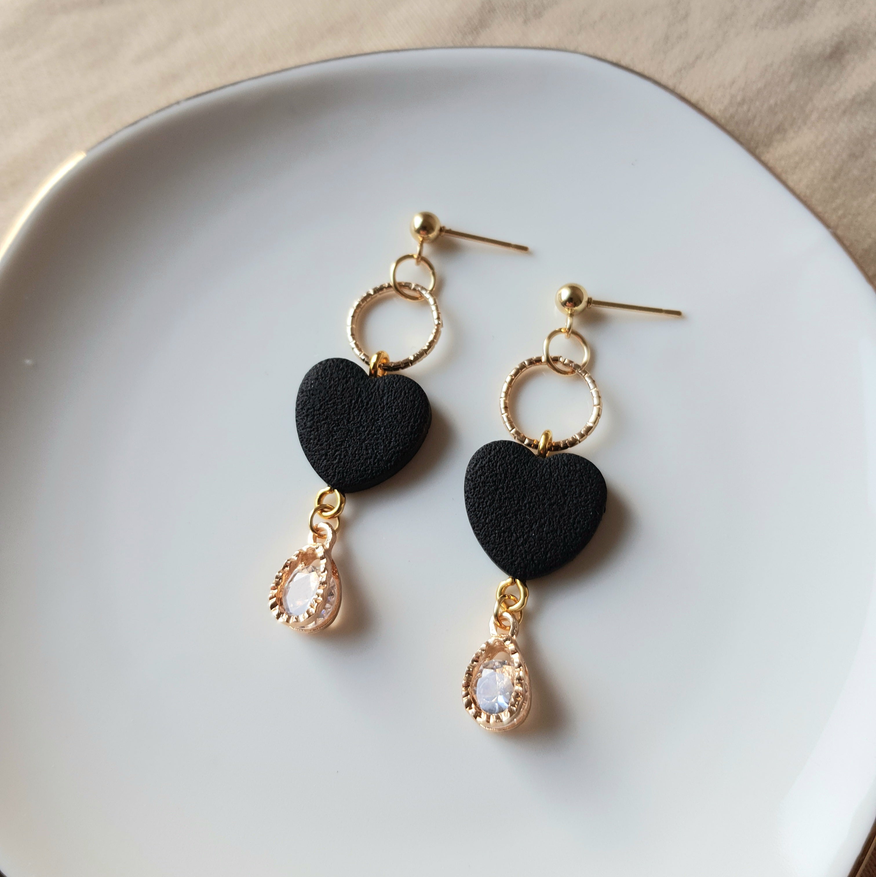 Black heart dangle earrings