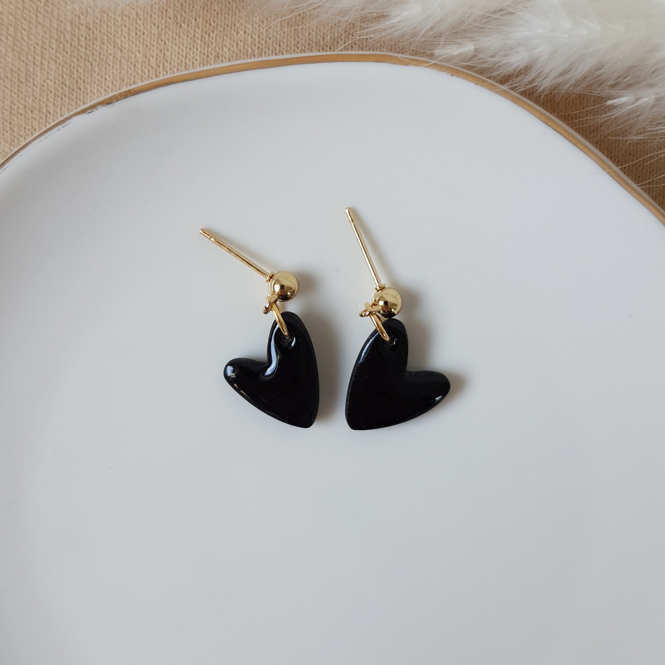 Black glossy dangle hearts