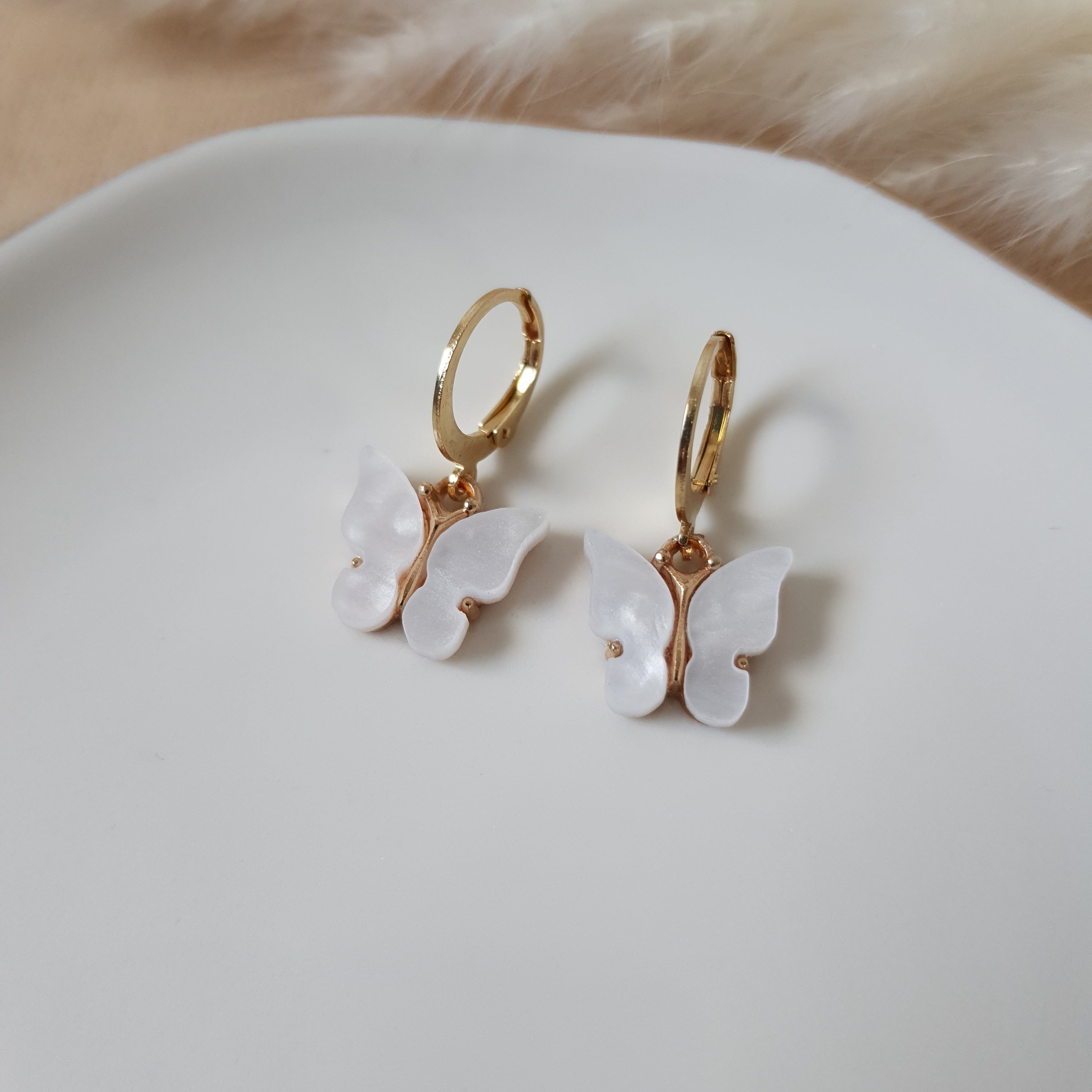 White butterfly earrings