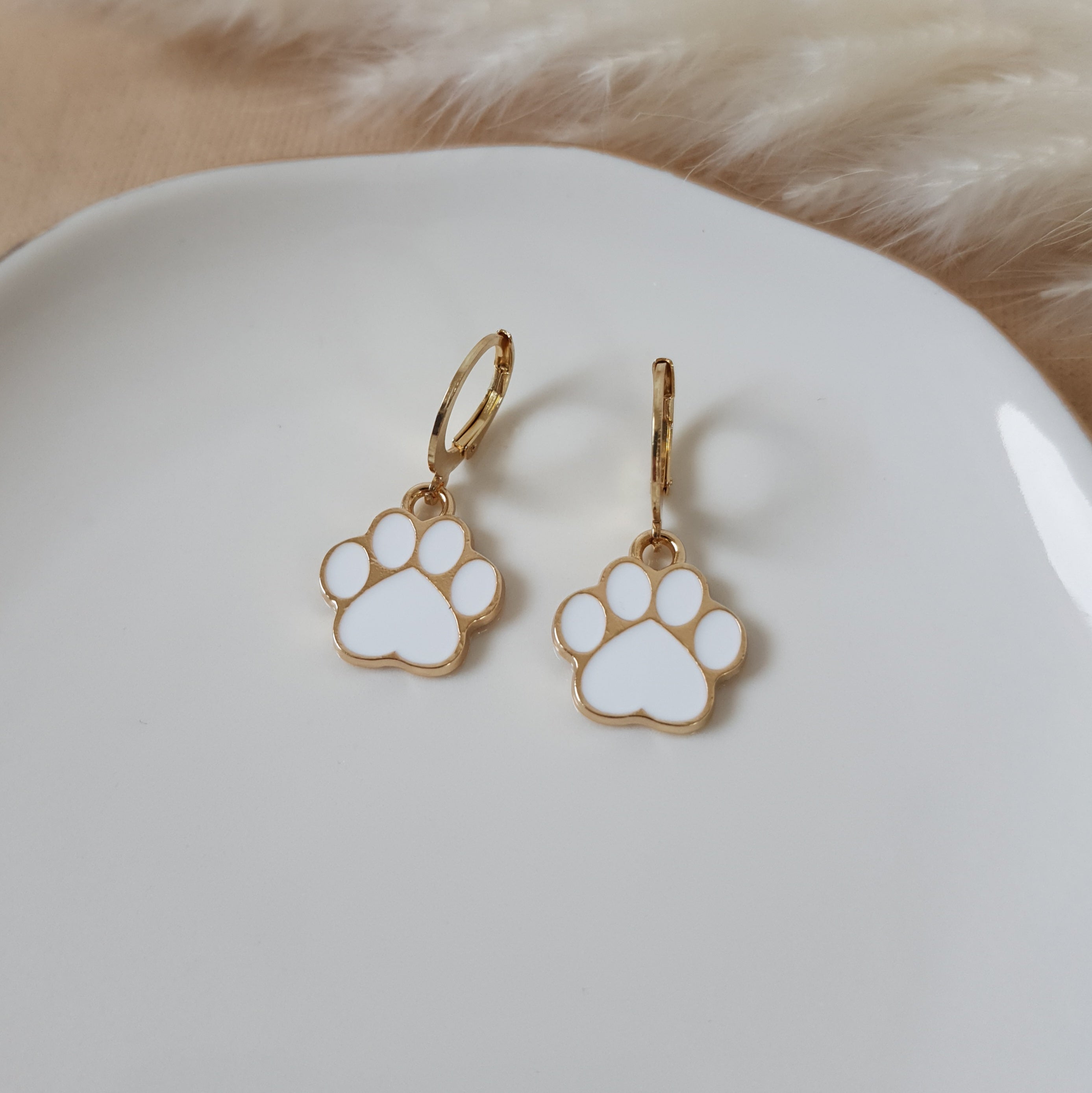 White paw earrings