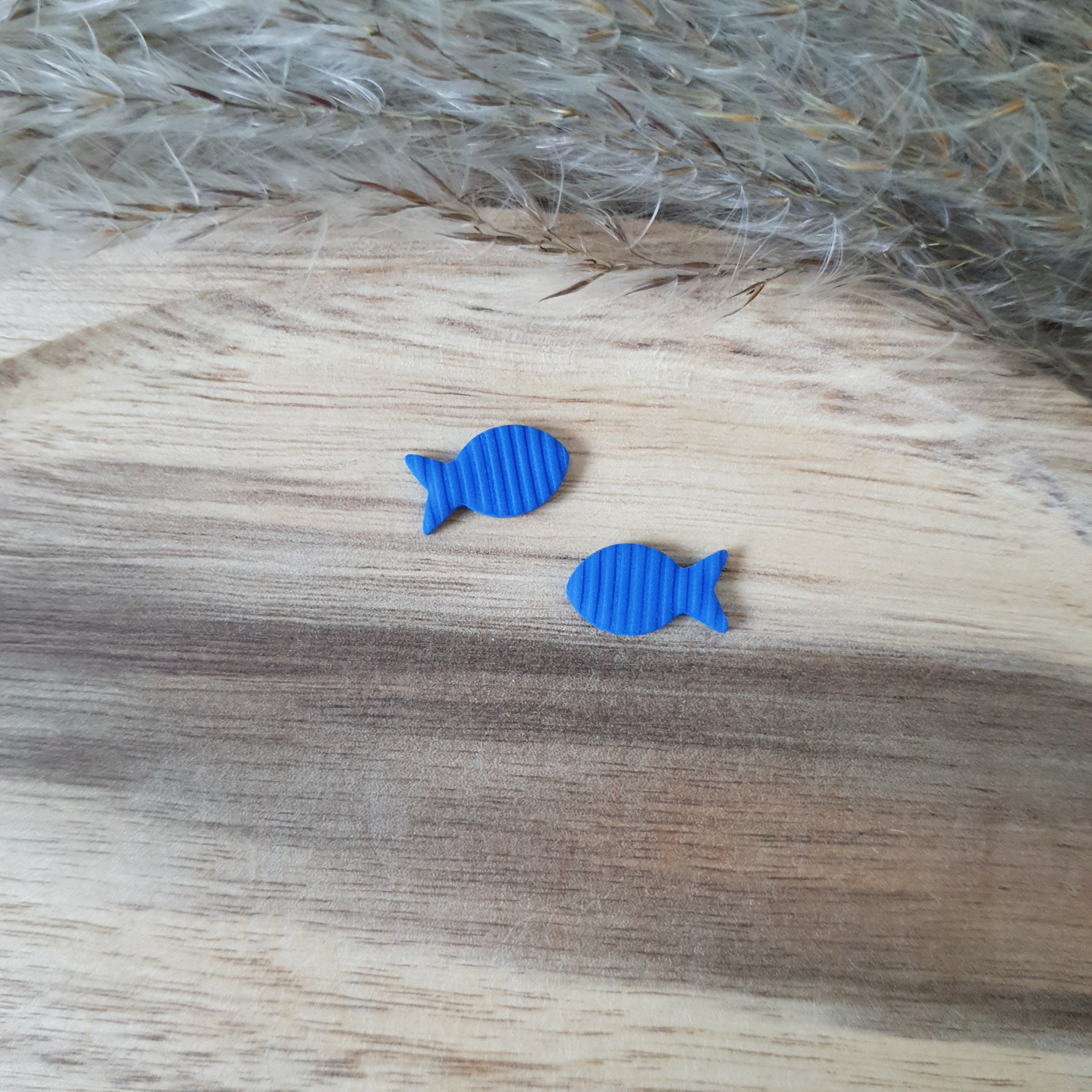 Blue fish stud earrings