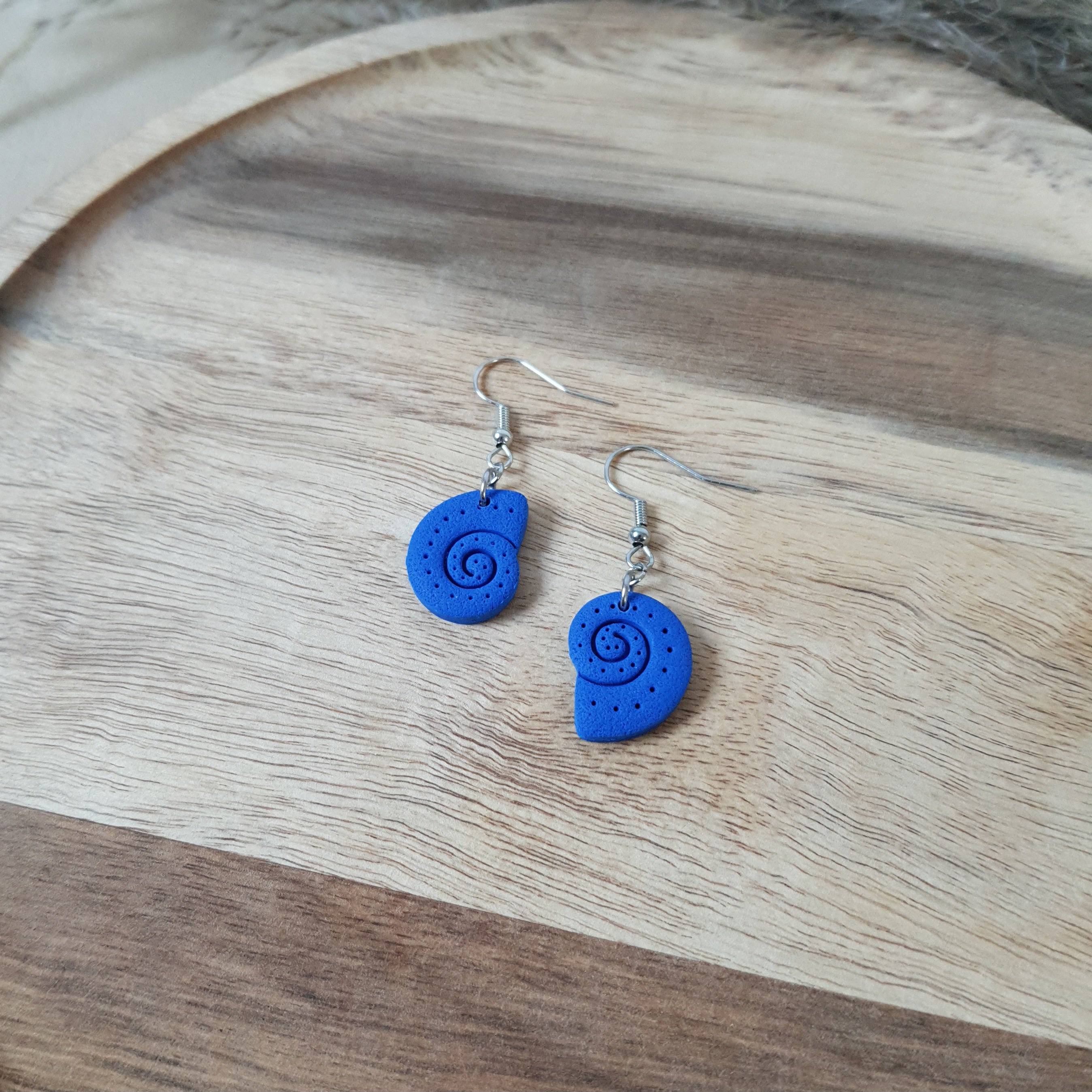 Blue snail dangle earrings
