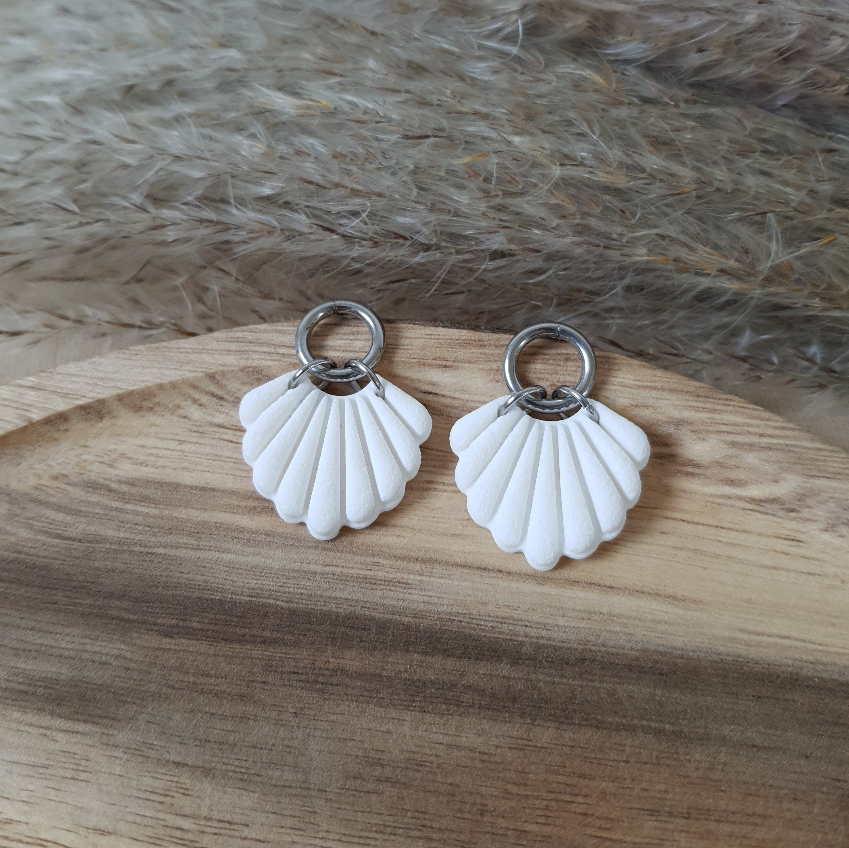 White shell and silver earrings
