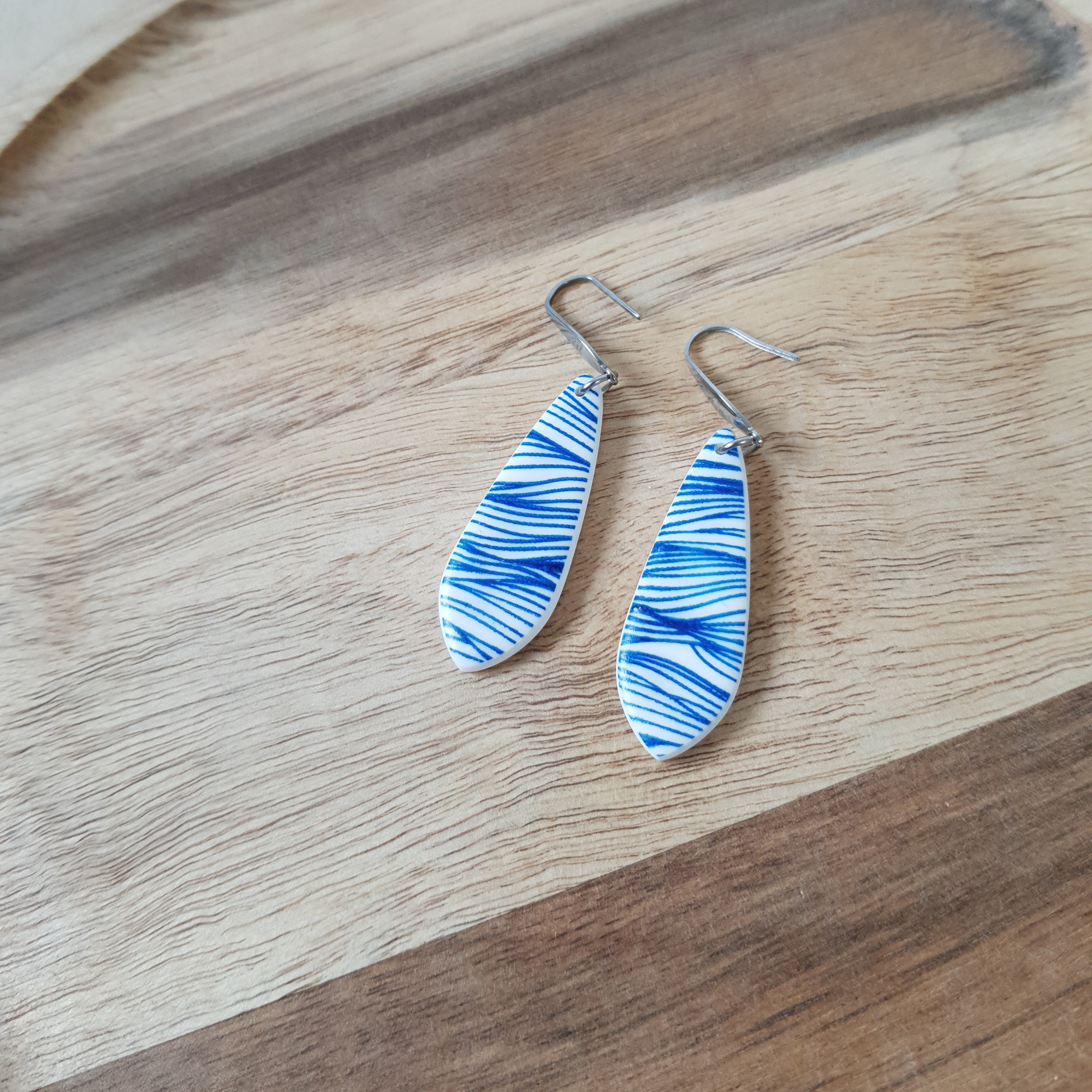 Blue waves dangle earrings