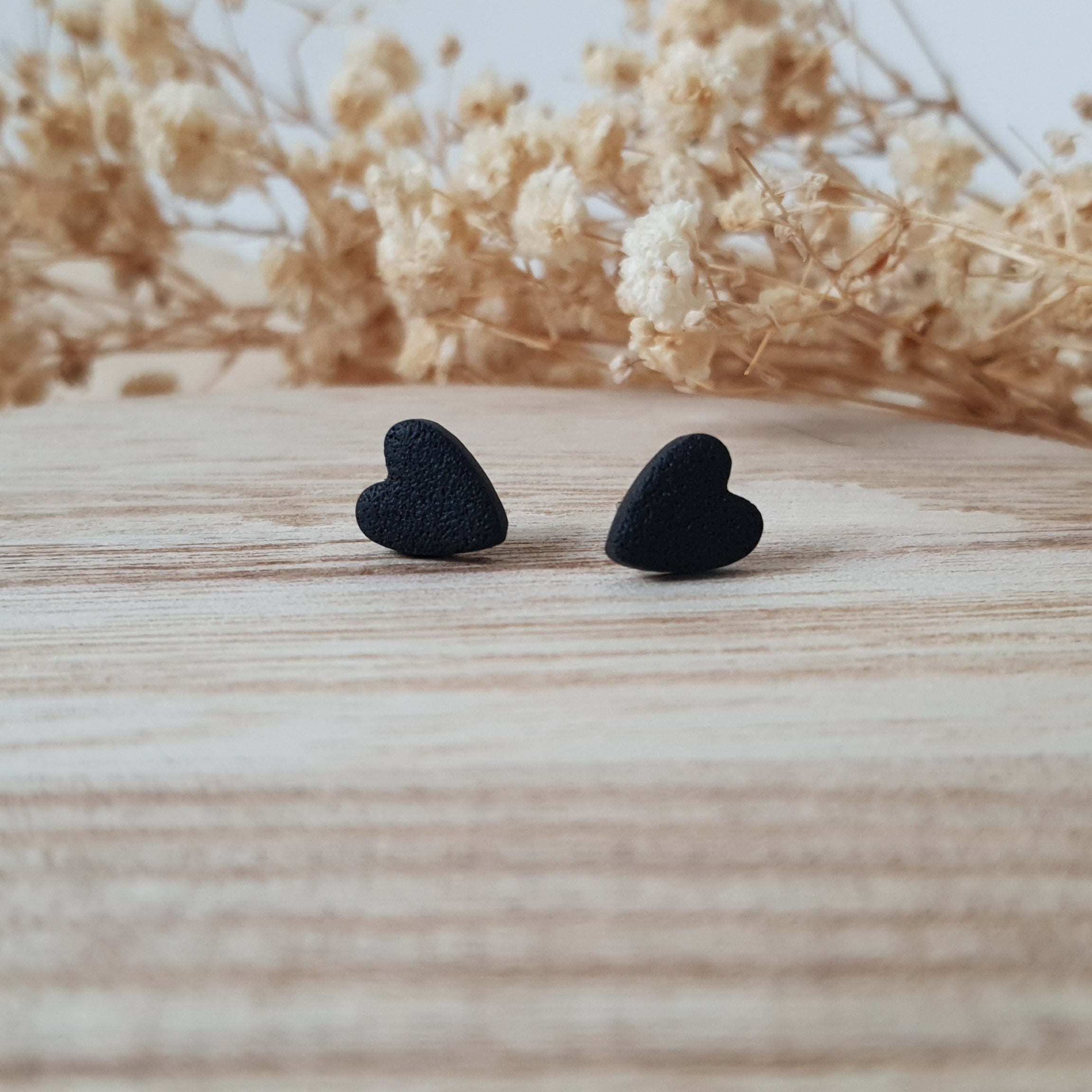 Black heart stud earrings